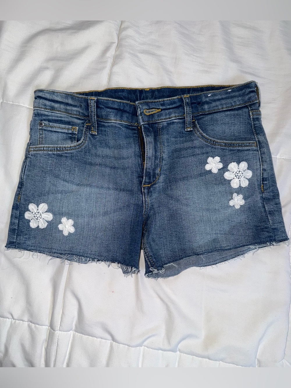 H&M Blue Denim Shorts with White Floral Appliqué
